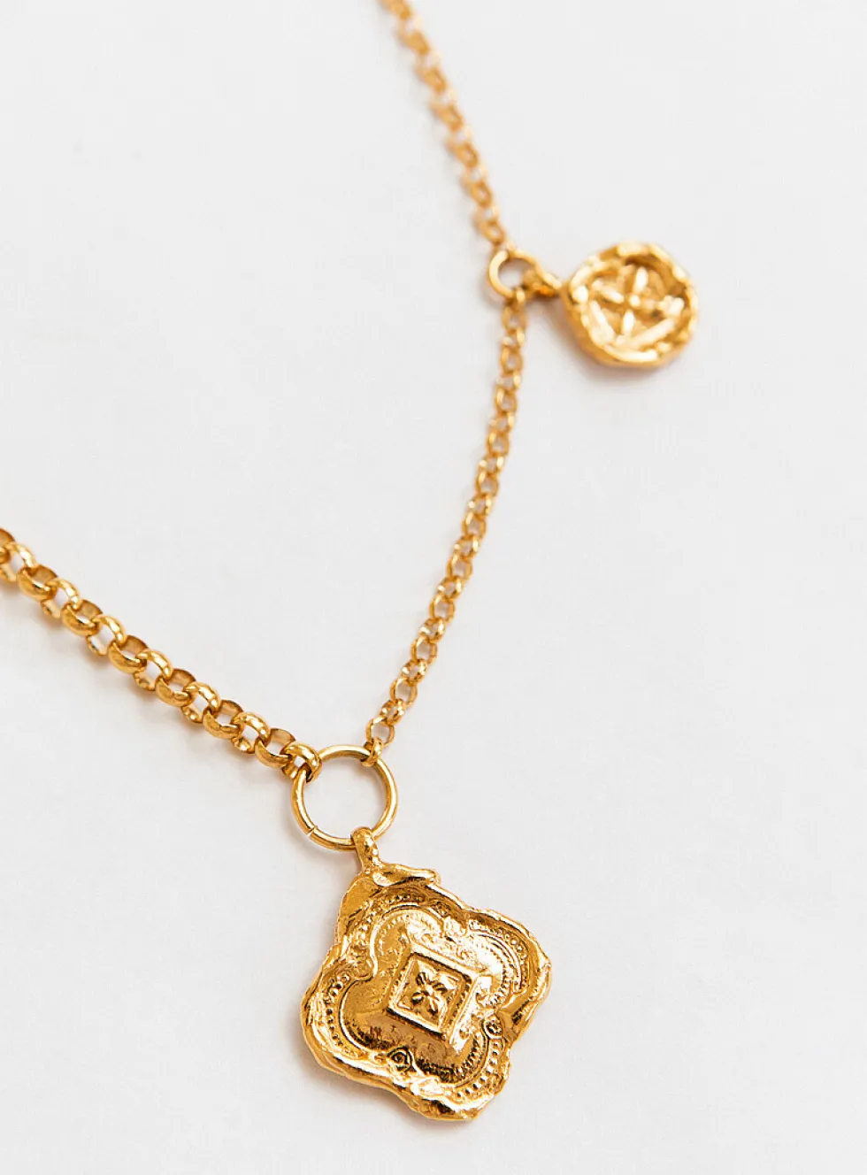 Colliding compass necklace