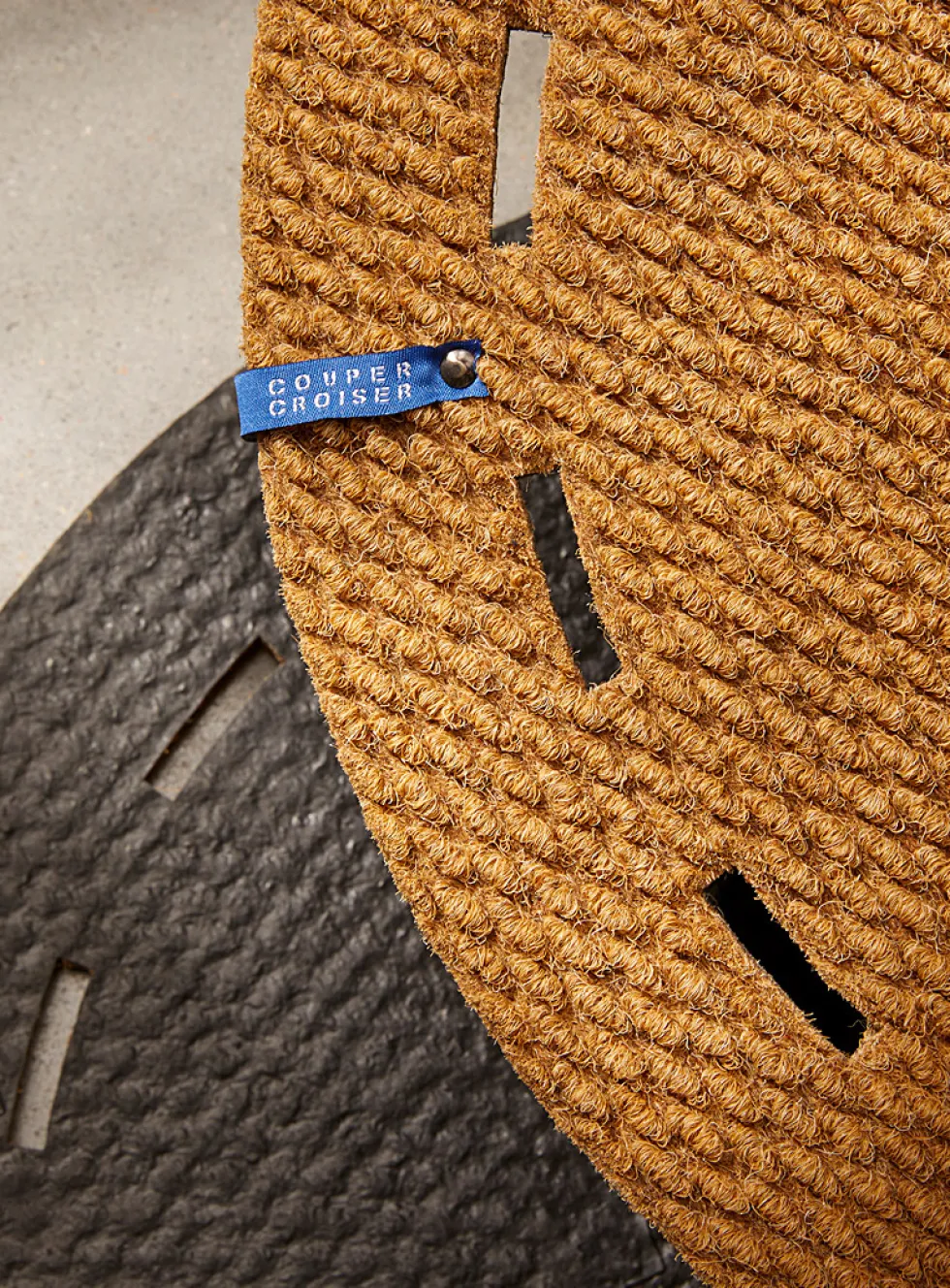 Dotted cutouts oval doormat