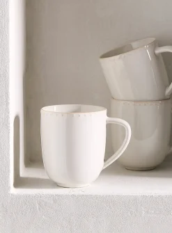 Embossed polka dots white mug
