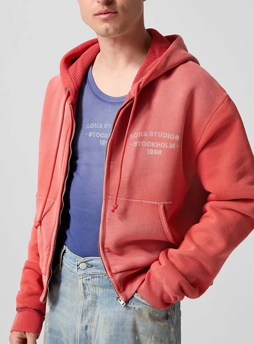 Faded red zip-up hooded sweatshirt