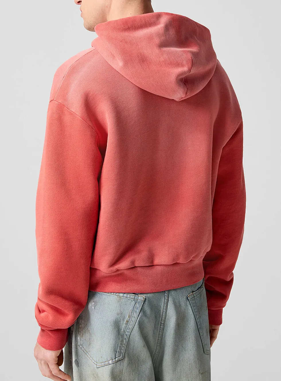Faded red zip-up hooded sweatshirt