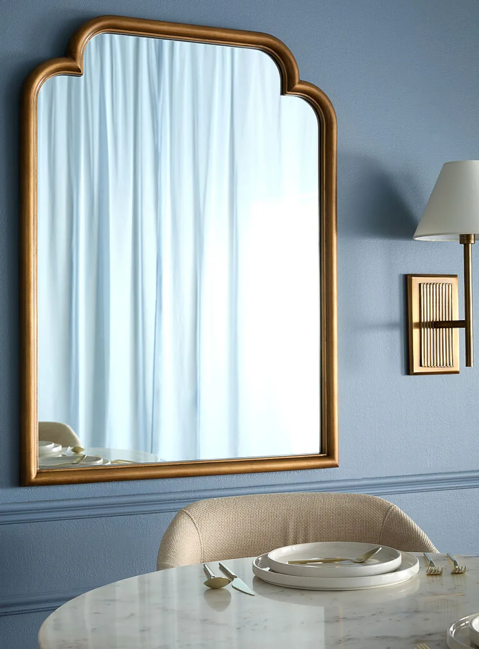 Gold leaf arched mirror