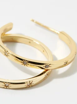 Large shimmery star hoops