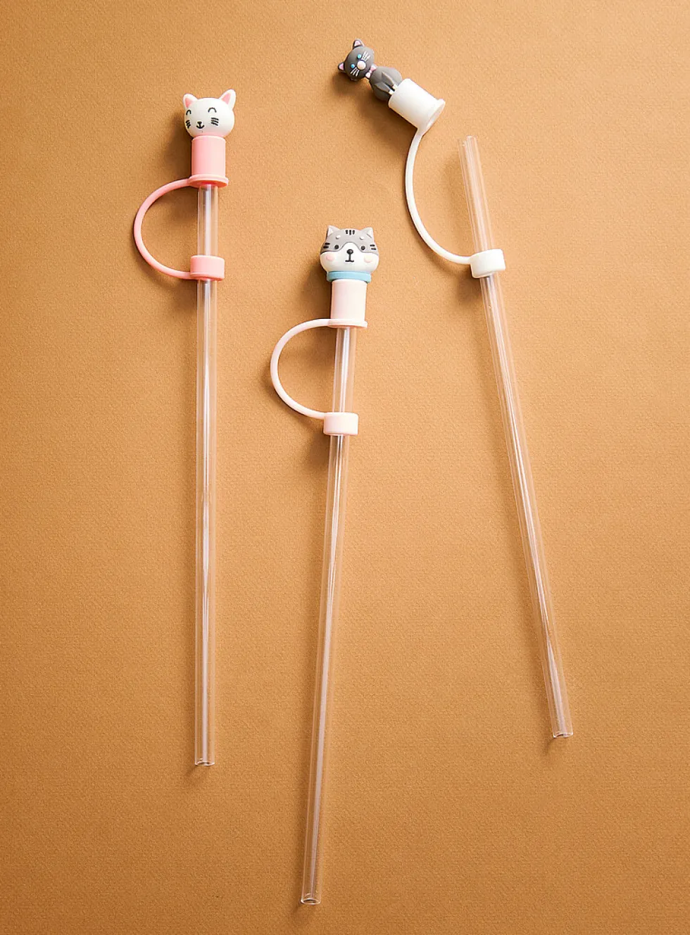 Large transparent straws with playful stoppers