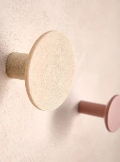 Matching circular wall-mounted hooks