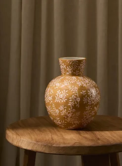 Pink flowers rounded ochre vase