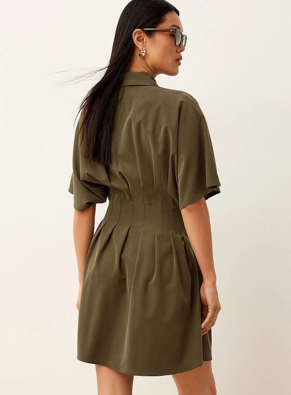 Pleated cinched minidress
