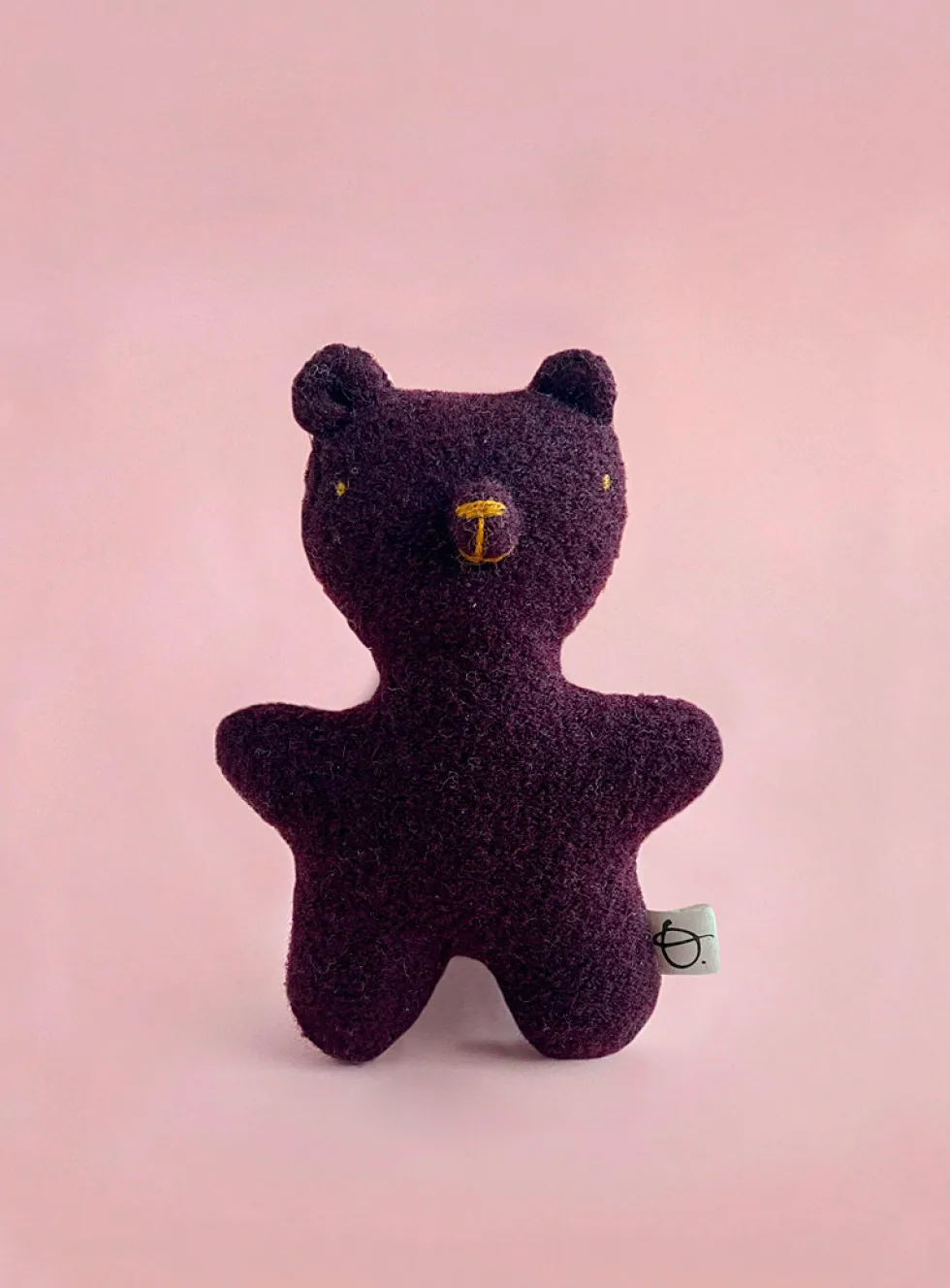 Plum wool stuffed bear
