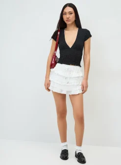 Polka-dotted smocked V-neck T-shirt