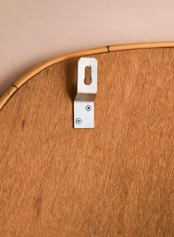 Rattan trim asymmetrical mirror