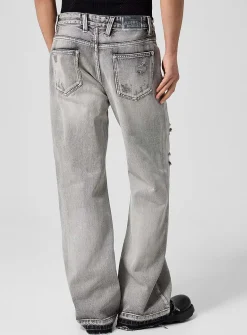 Raw edging mended flared-leg jean