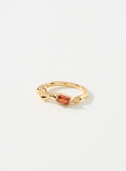 Red-stone asymmetric ring