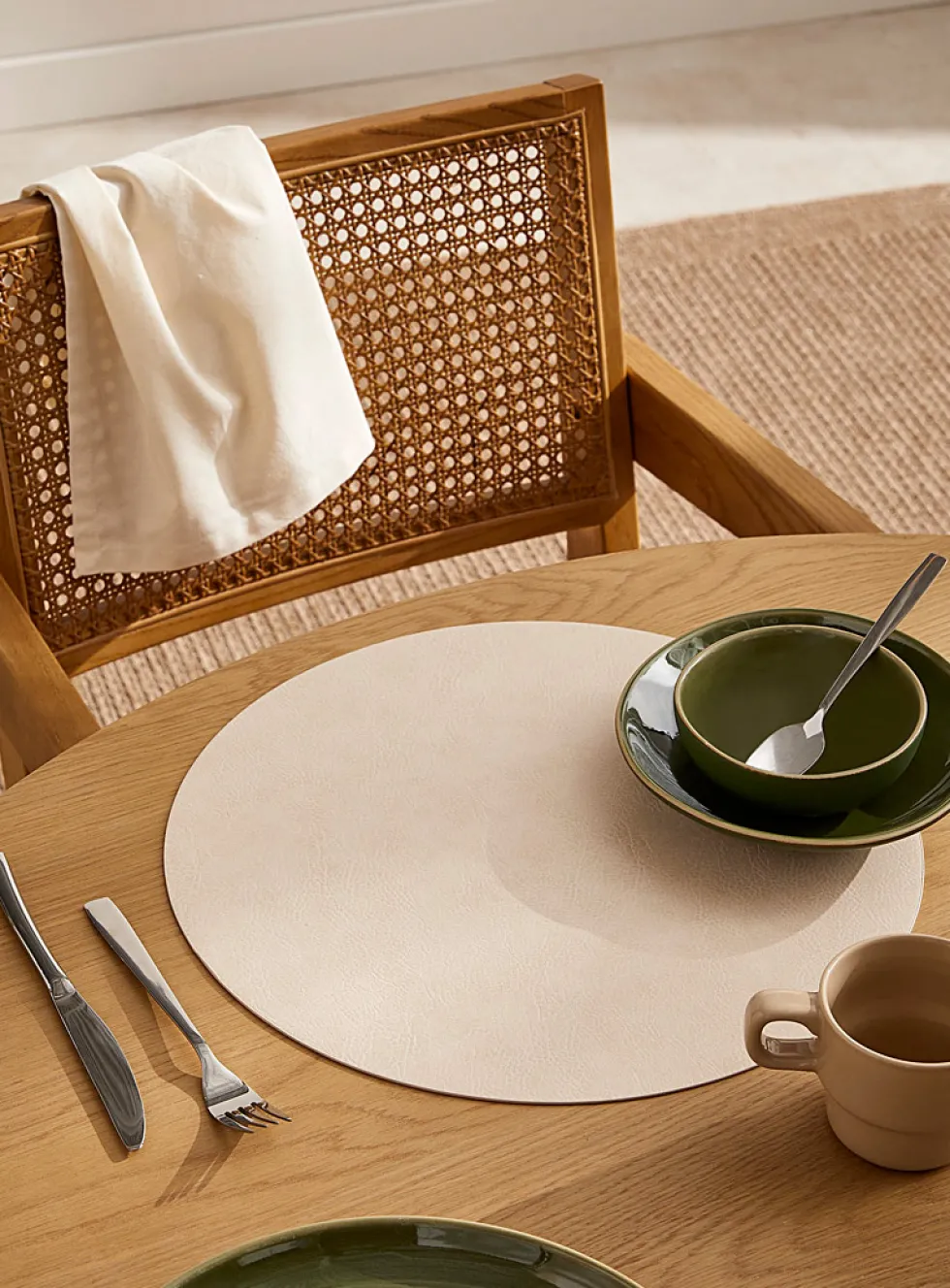 Round faux-leather placemat