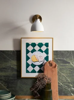 Sleek bell-shaped wall sconce