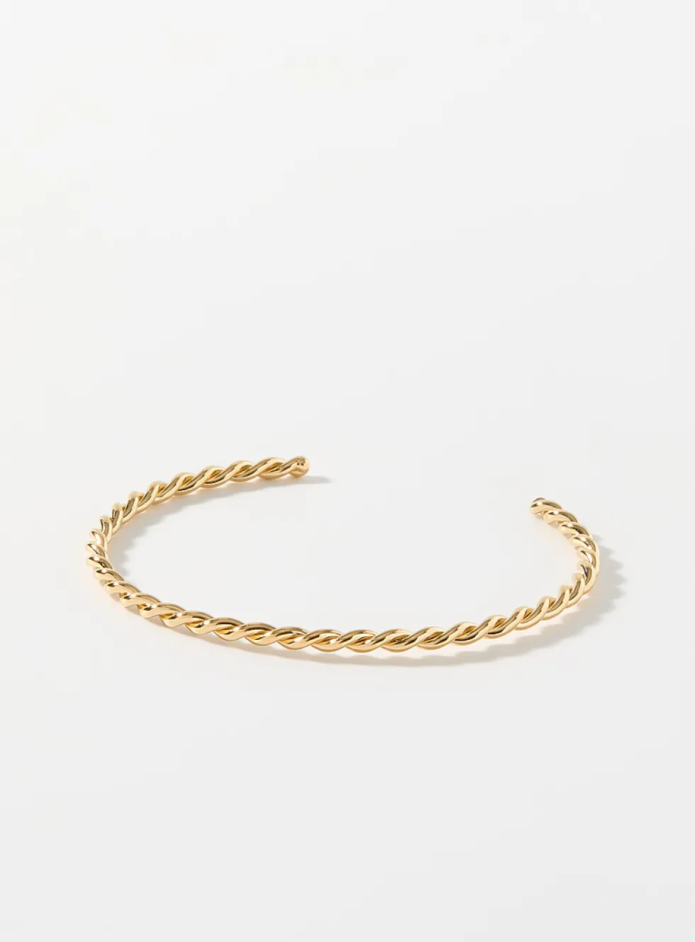 Twisted openwork golden bracelet