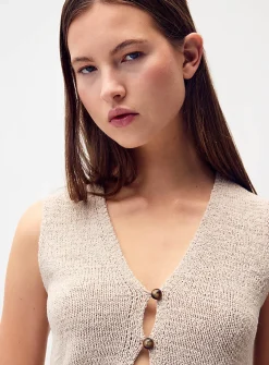 Two bead buttons sweater vest