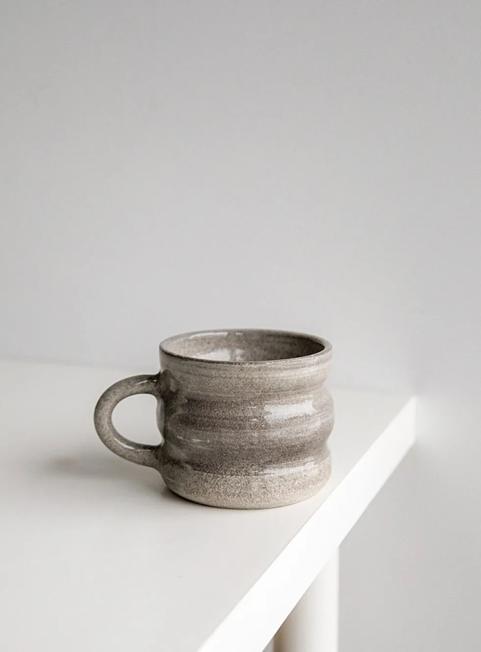 Wavy ceramic cup